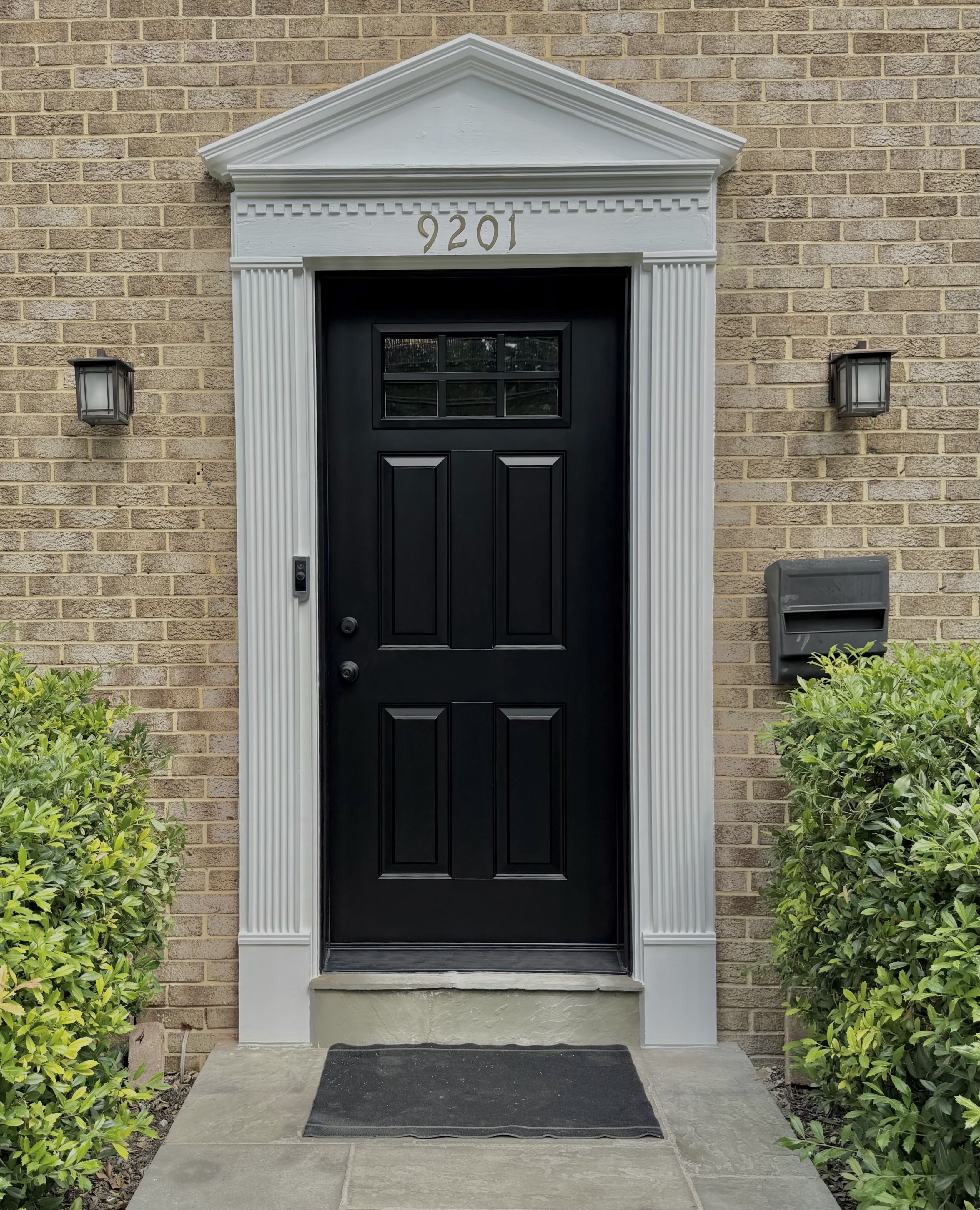 Luxury black front entry door professionally installed on a Bethesda home