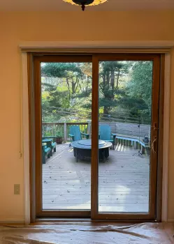 Patio Door Replacement and Wall Dog Door Installation project photo.