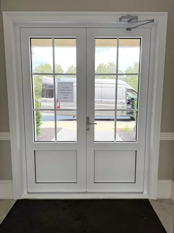 White double glass door with metal handle and exterior view