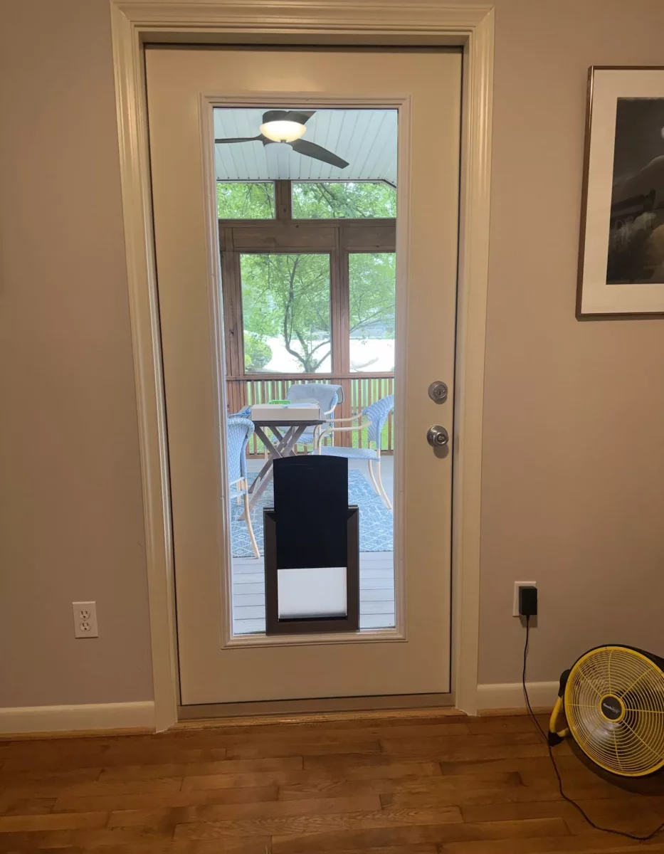 Interior view of a door with a pet door installed