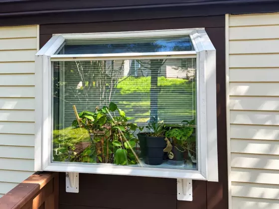 Garden window with newly replaced insulated glass units after professional glass replacement in Maryland