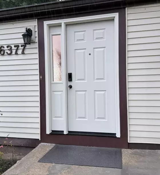 After: New ProVia Ascent fiberglass entry door with privacy glass sidelight professionally installed in Columbia, MD.