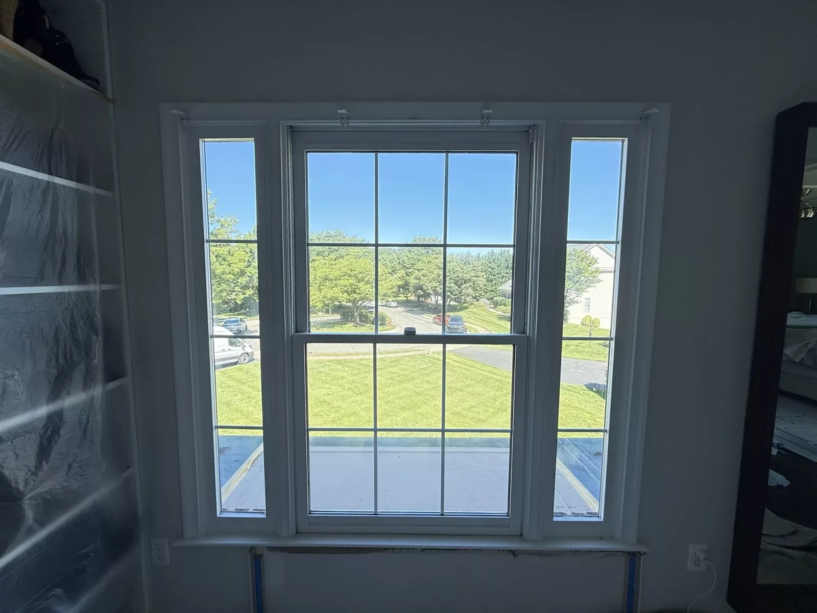 Before window replacement showing the original three-section double-hung window configuration in a Rockville, MD home