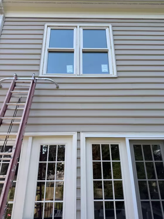 New energy-efficient double-hung window installation in Rockville, MD, shown before exterior trim and sealing are completed.