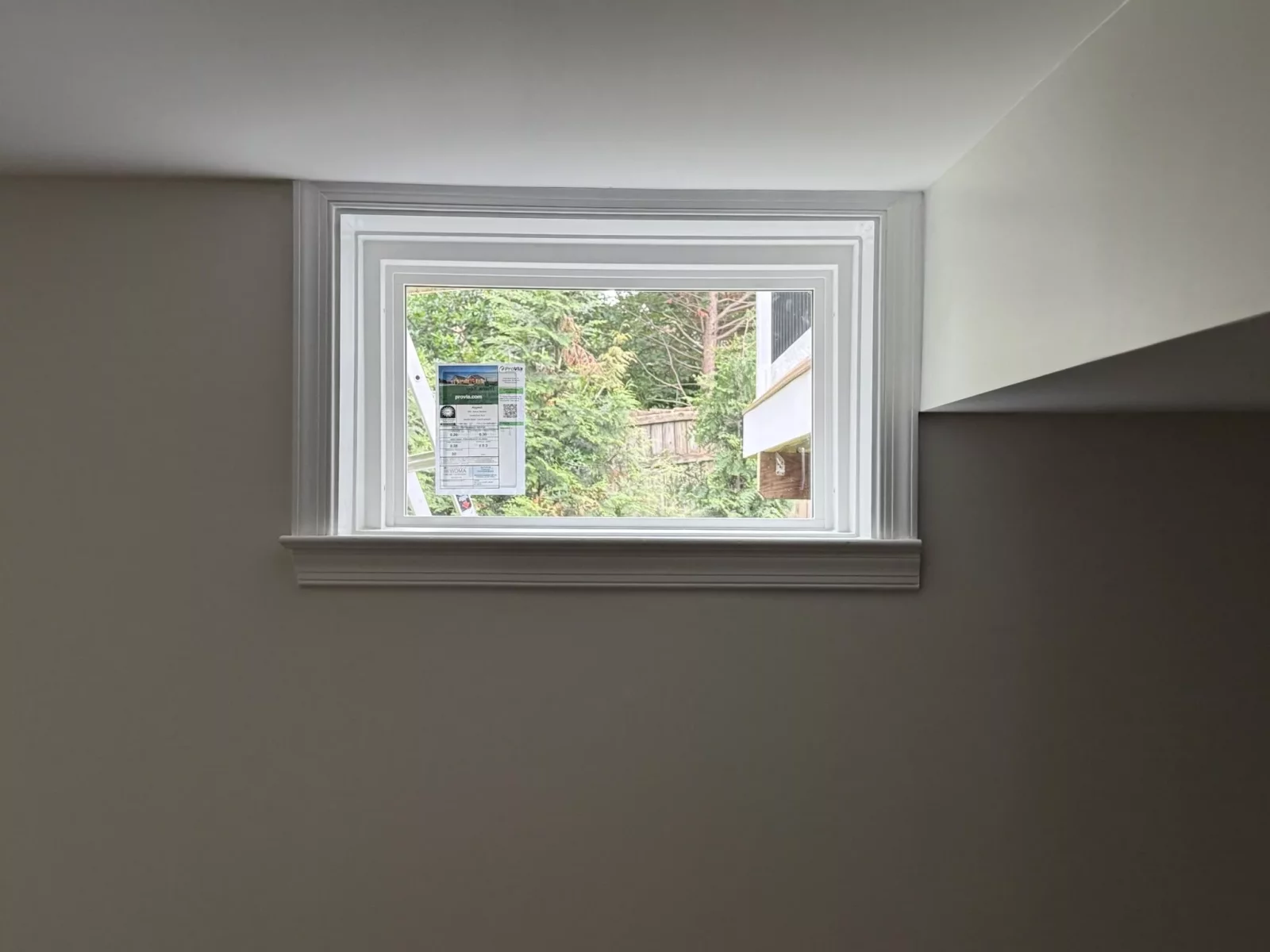 Energy-efficient basement window replacement in Rockville, MD, with clean interior trim and professional full-frame installation.