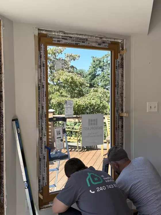Oknoplast tilt-and-turn window installation showing professional frame leveling and securing in Monrovia, Maryland