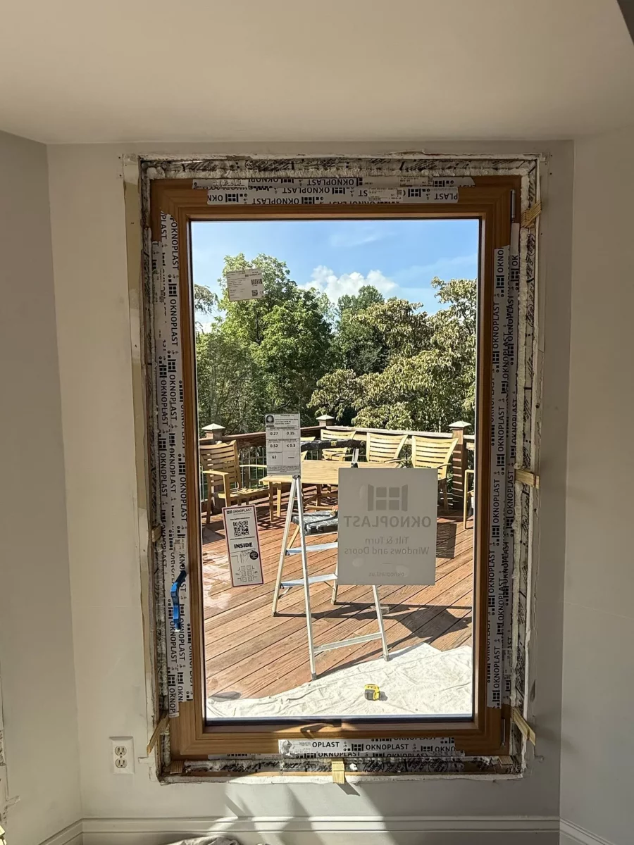 Window installation in progress with protective film and tools visible