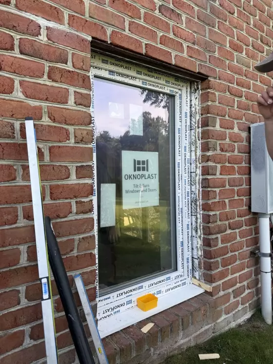 Tilt and turn window installation in brick exterior wall
