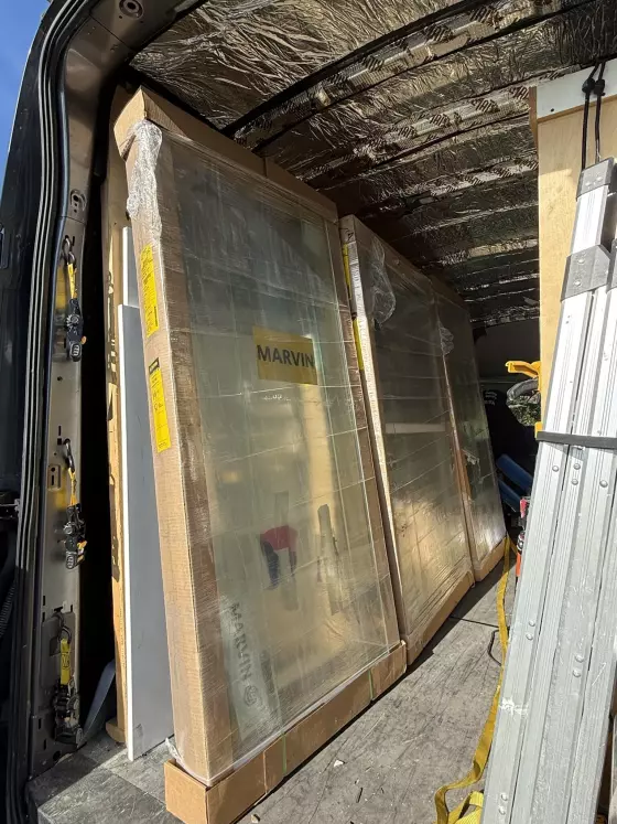 New Marvin Elevate windows delivered to the job site and ready for professional full-frame window installation.